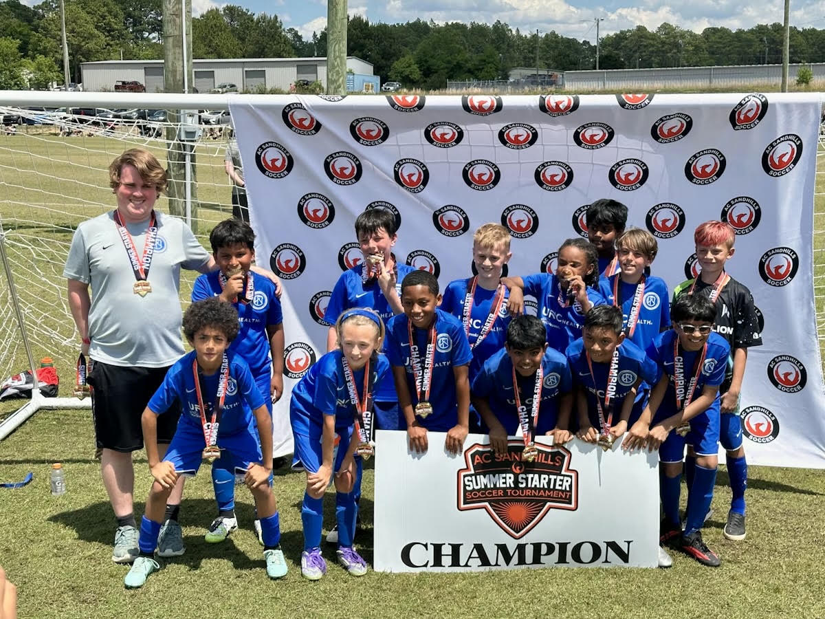 U11 team celebrating their championship win