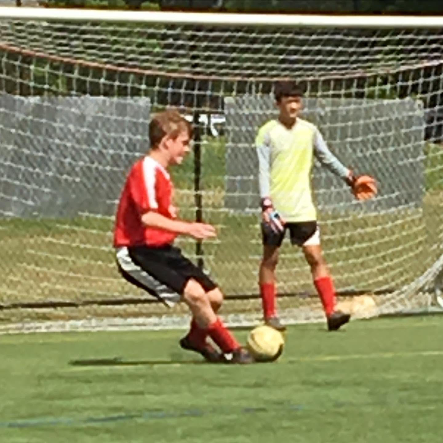 Players training near the goal